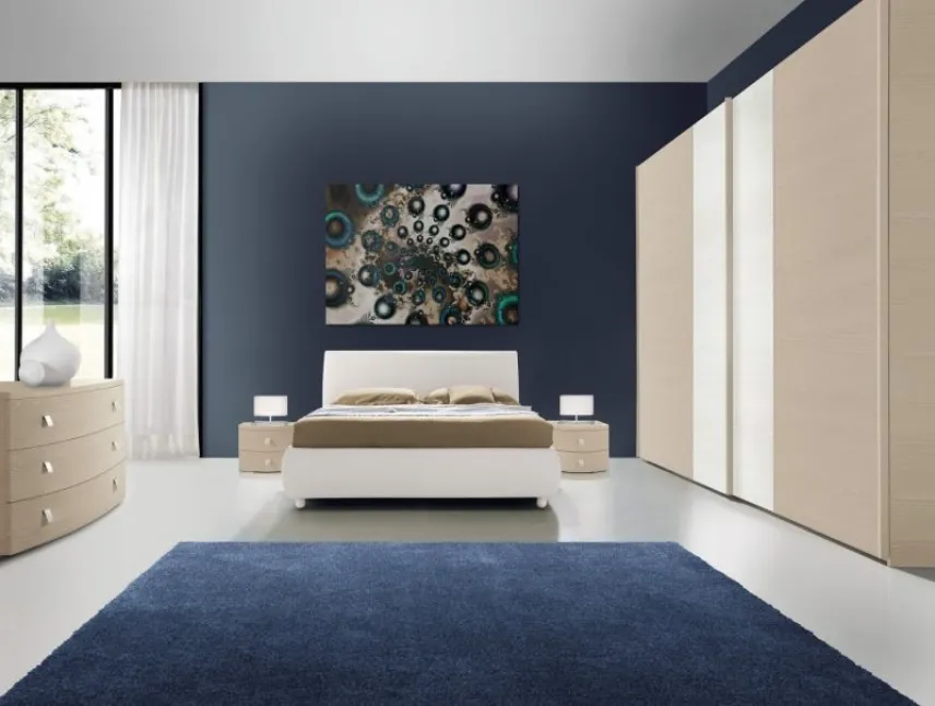 Come disporre i quadri moderni nella camera da letto
